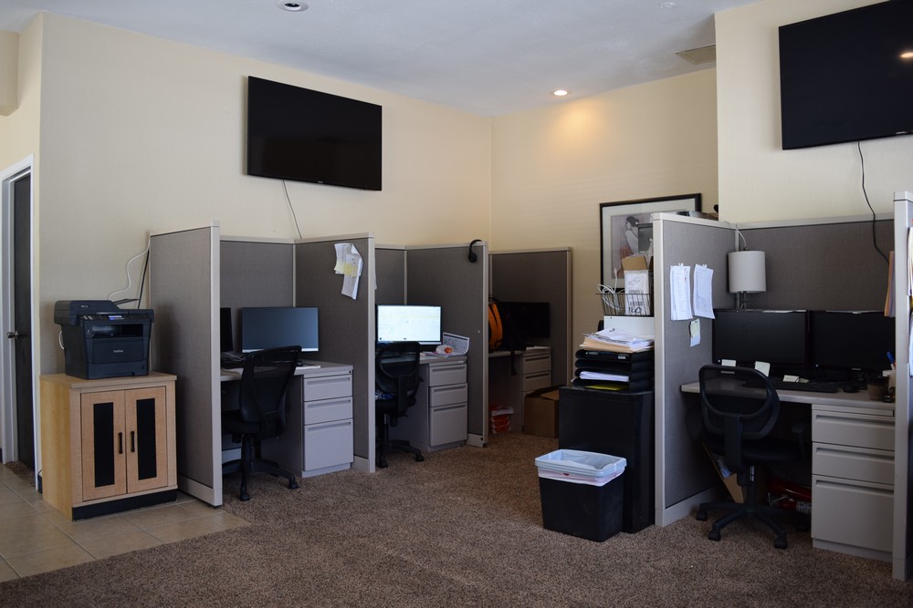 Each employee has their own desk and computer