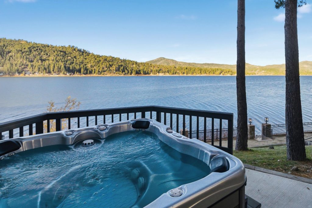 Private hot tub overlooking Big Bear Lake with scenic mountain views and a peaceful waterfront setting