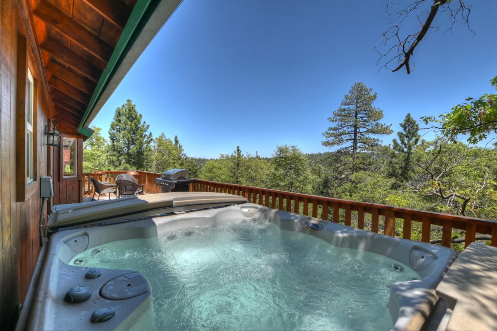 An outdoor hot tub on a deck at a cabin in Big Bear.