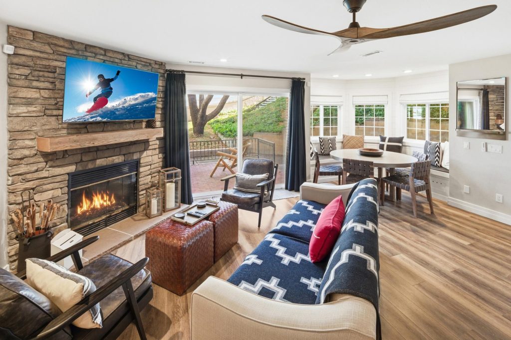 Bear Mountain skiing and snowboarding themed living room with fireplace and mountain decor