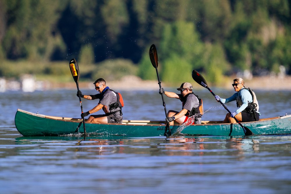 Three people canoeing on a lake at Big Bear.