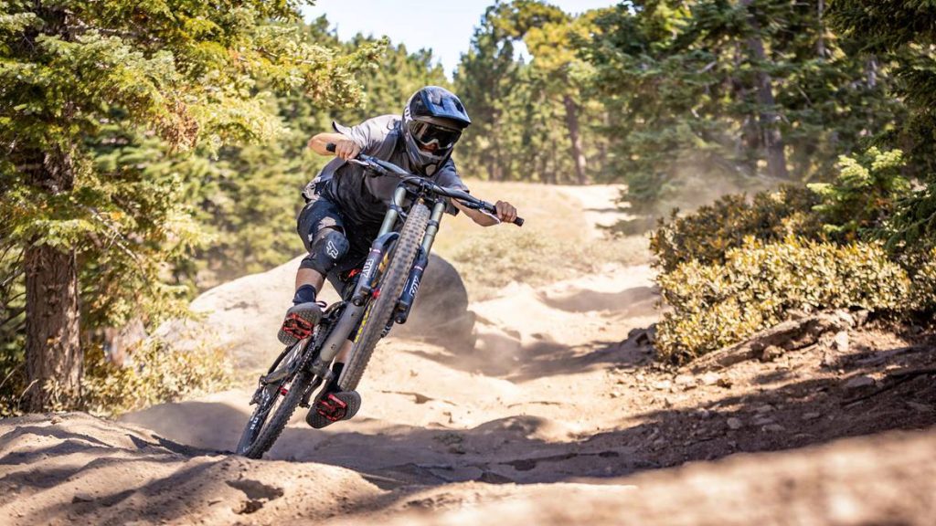 Mountain biker riding downhill at high speed during the Monster Energy Pro Downhill Series in Big Bear