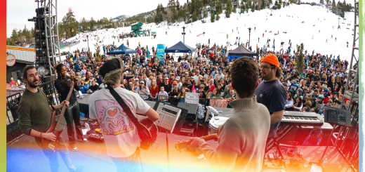 Crowd enjoying an outdoor AJR concert with colorful gradient overlay