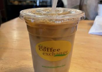 Coffee exclamation sign at The Tea & Coffee Exchange in Big Bear, New York, highlighting the shop's specialty in coffee.
