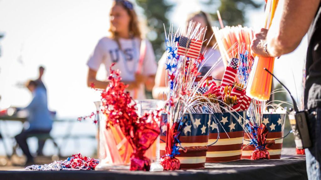 A table adorned with patriotic decorations and an American flag, celebrating the 4th of July in Big Bear.