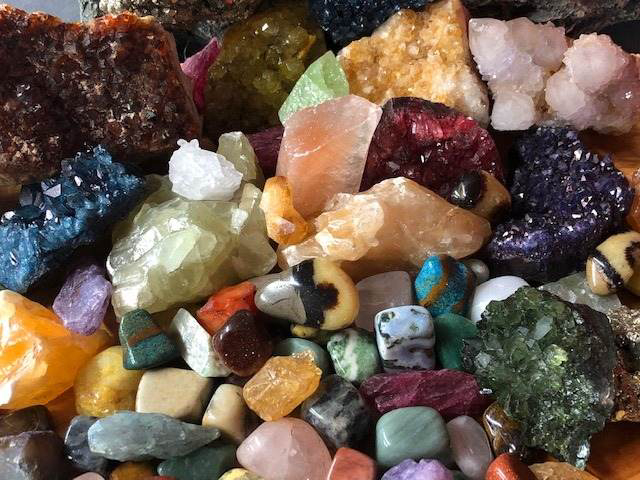 Close-up view of colorful gemstones and crystals available at Gold Rush Mining Co