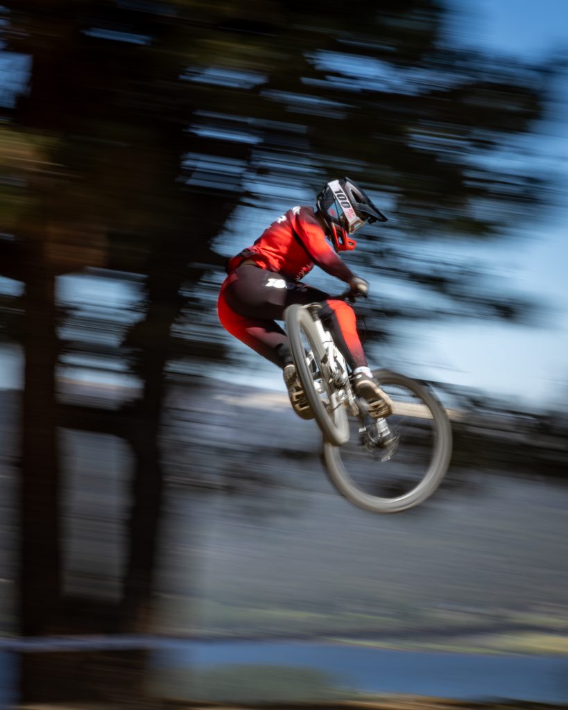 A mountain biker jumps mid-air during an event at Big Bear.