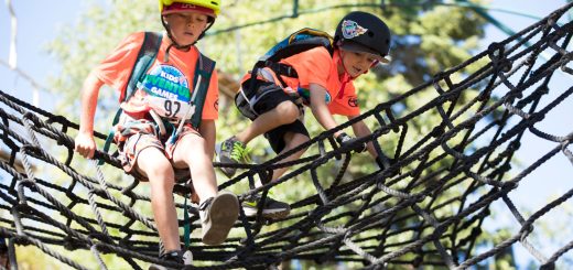 kids climbing rope obstacle during Kids Adventure Games Big Bear outdoor challenge