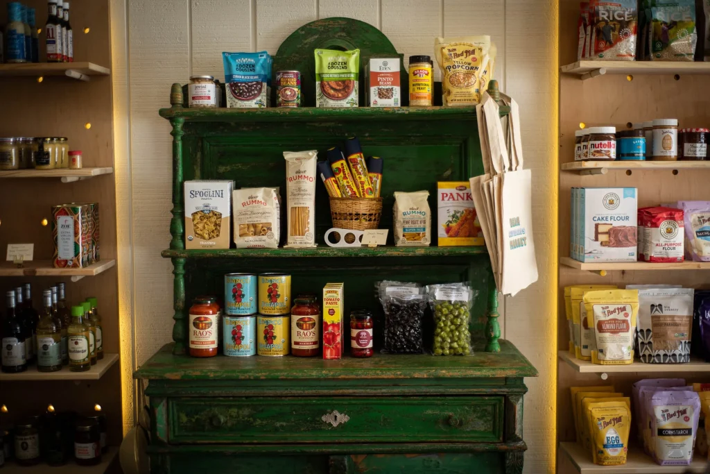 A shelf displaying pantry essentials and specialty foods in Big Bear, showcasing a variety of food items.
