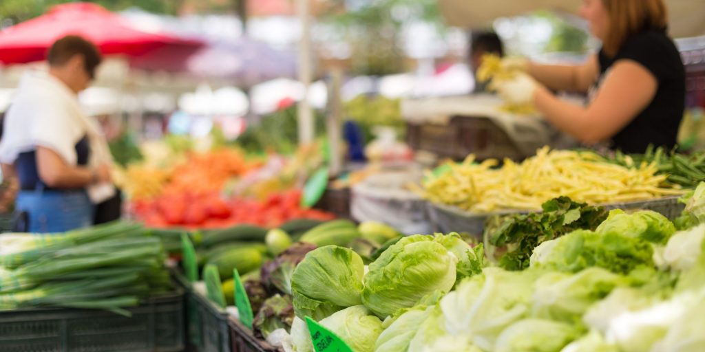 Leafy greens and fresh vegetables at a vendor stall during Big Bear Farmers Market.