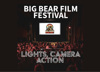 Big Bear Film Festival logo on a white movie theater screen. Theater crowd sitting in seats in dark theater looking at screen.