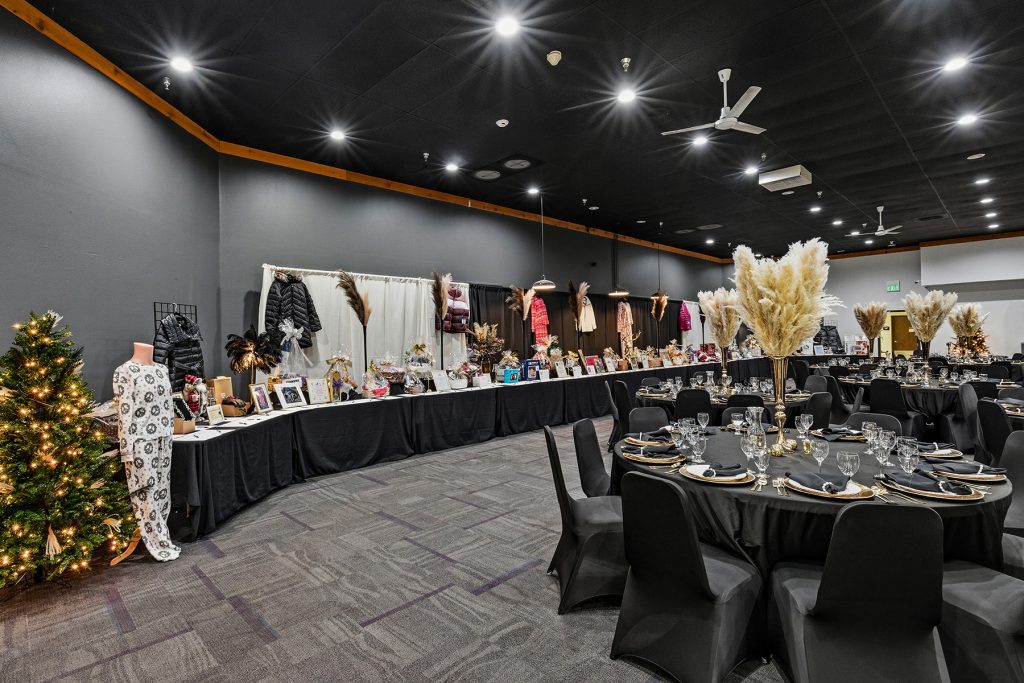 Banquet hall with large illuminated letters and event table setup