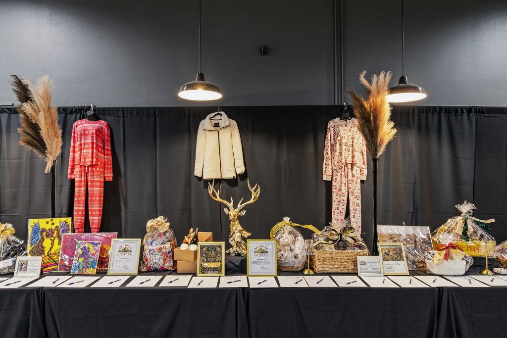 Gift display table at event with decorative items and arrangements
