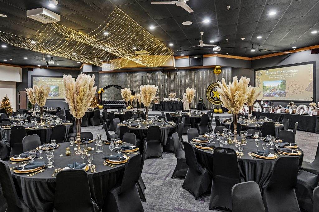 Close-up banquet table with glassware and decorative centerpiece