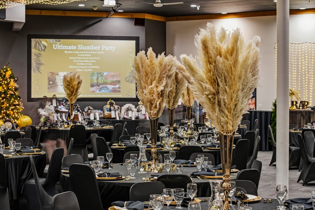Close-up of decorative feather centerpiece with ambient lighting background
