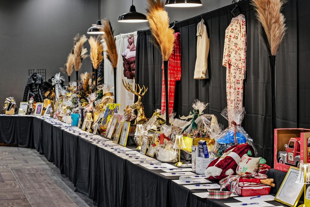 Banquet decor detail with feather arrangement and warm light accents