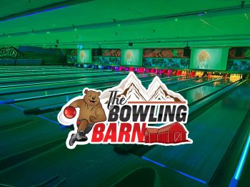 The Bowling Barn logo, showing a bowling bear, mountains, and a barn, is overlaid on a neon-lit bowling alley at Big Bear.