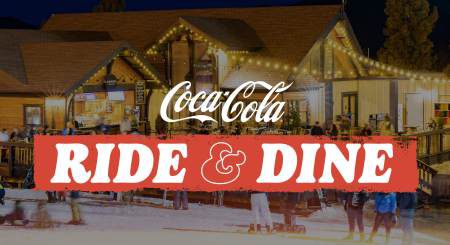 Coca-Cola Ride and Dine event at Snow Summit with evening skiing and guests gathered at the mountain base