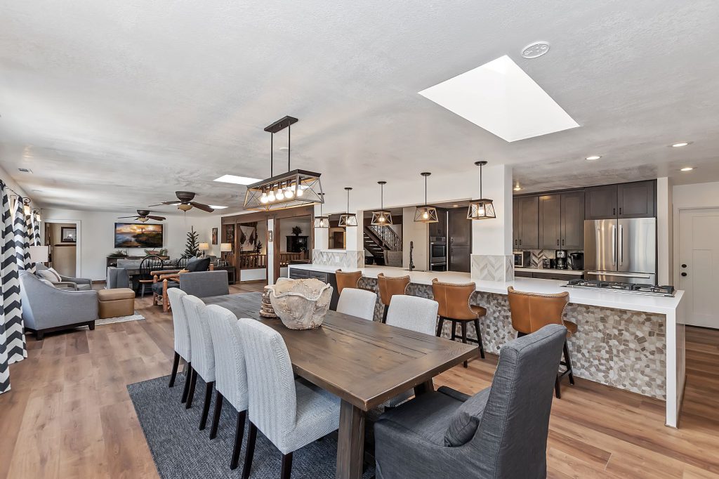A Big Bear home features an open kitchen and dining area with modern furnishings.