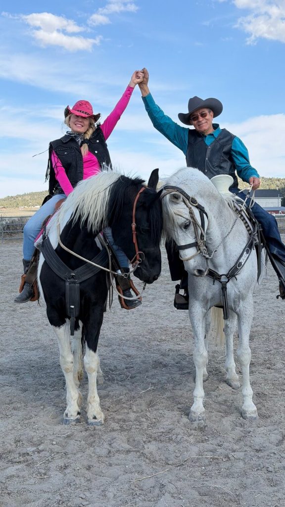 Guests enjoying a horseback riding experience at Starlight Mountain Theatre Ranch with scenic outdoor views.