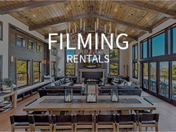 Living Room and dining table with fireplace in the far view at the Big Bear Black Rock cabin rental