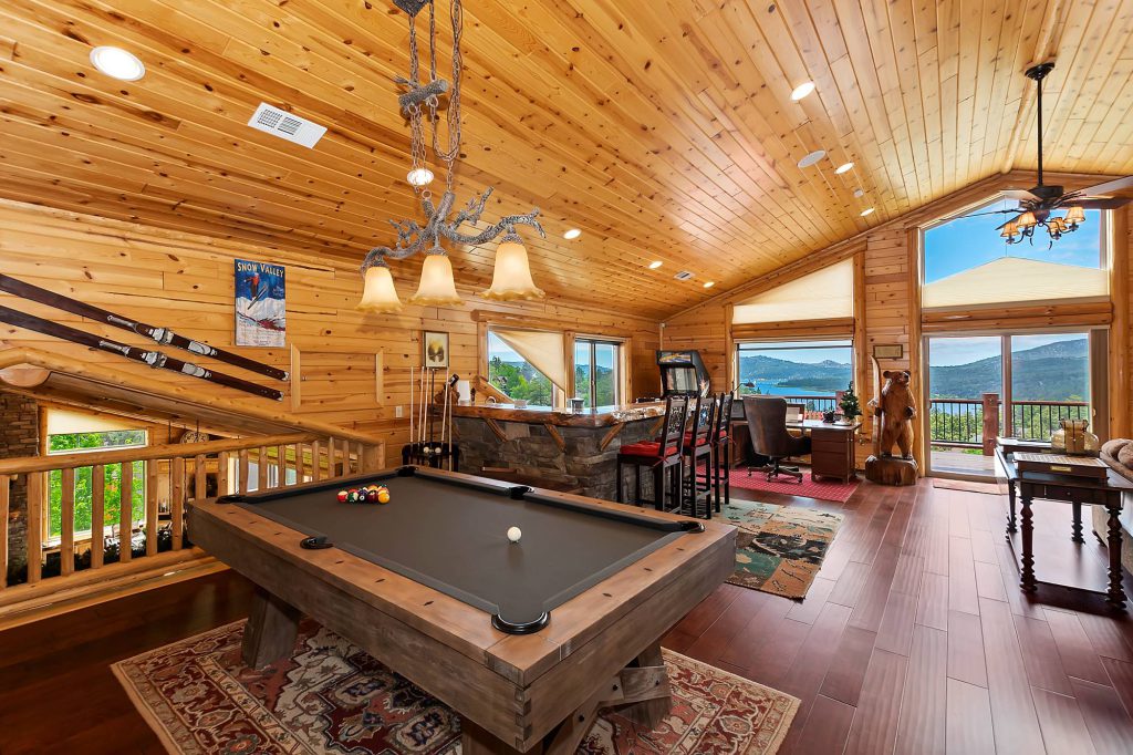 Cabin game room with pool table and bar at Destination Big Bear