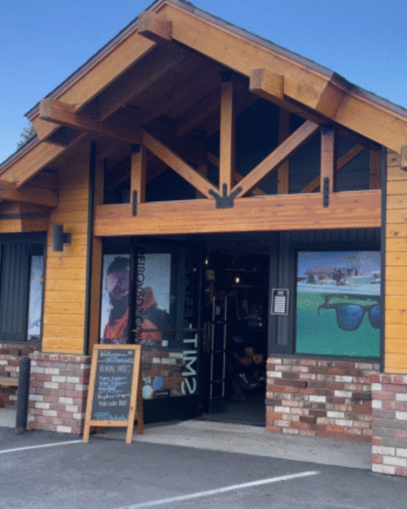 Front entrance of Get Boards bike and outdoor sports shop in Big Bear with a rustic mountain-style building.