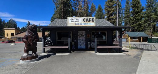 Breakfast served at Grizzly Manor Cafe including pancakes, eggs, bacon, and hash browns.