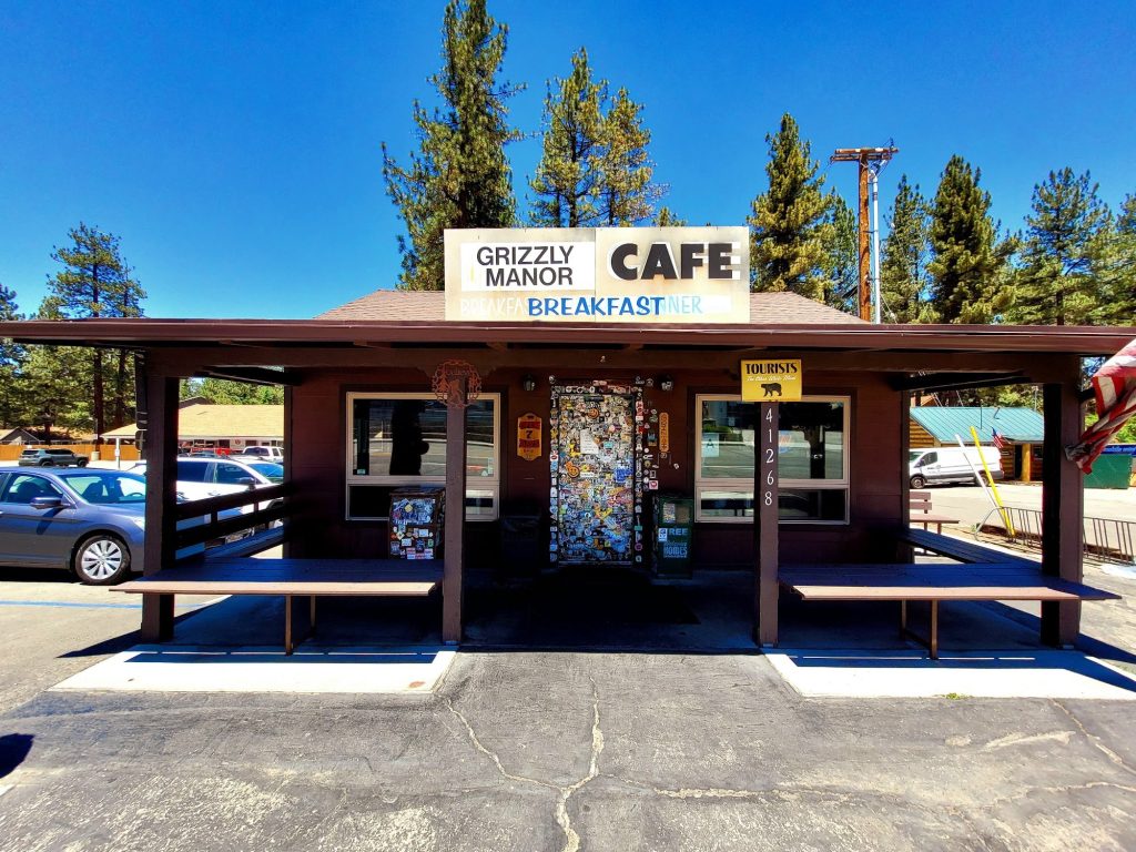 Exterior view of Grizzly Manor Cafe in Big Bear Lake, showing the entrance and signage.