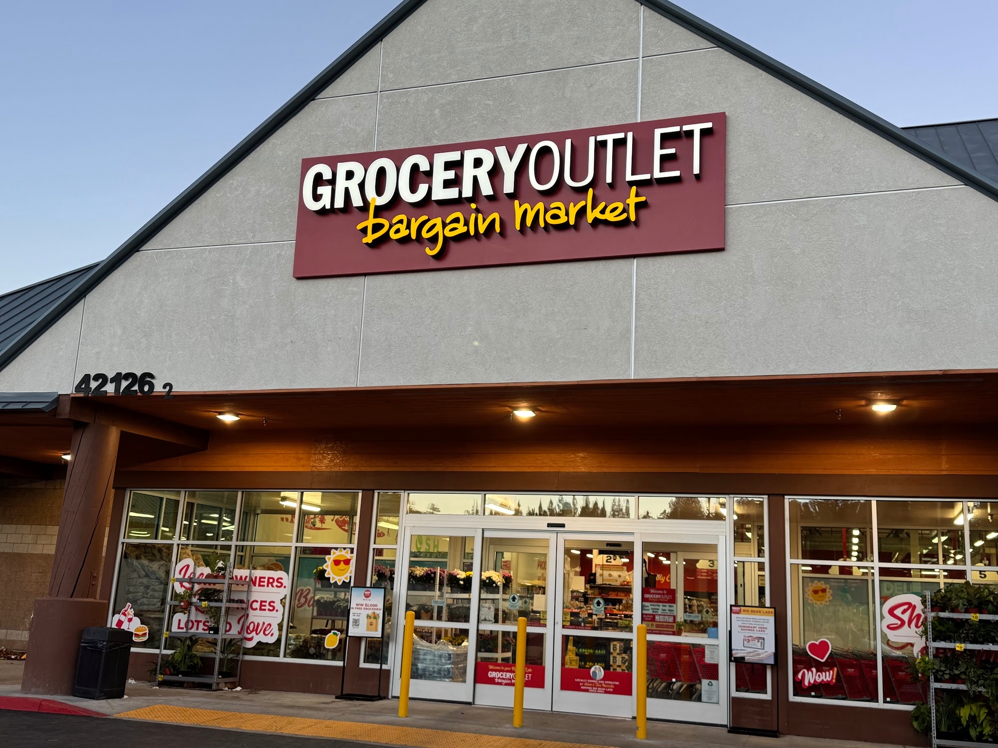 Exterior view of Grocery Outlet Bargain Market featuring the store entrance and shopping area.