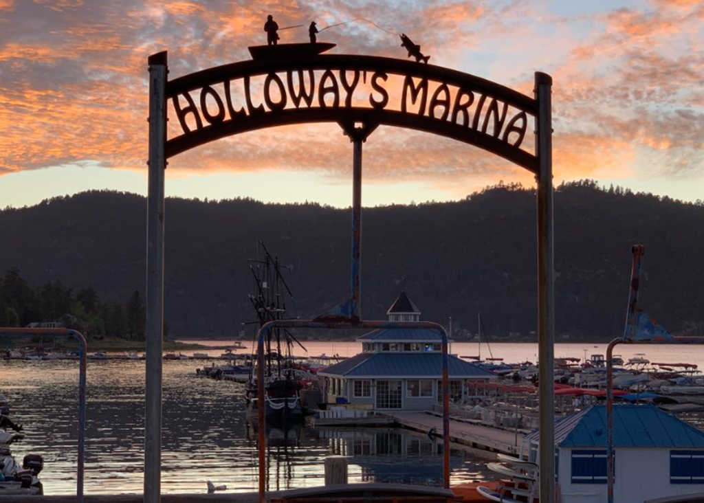 Enjoy the Pirate Ship Tour at Holloway's Marina, Big Bear Lake, with beautiful sunset views and serene lake waters.
