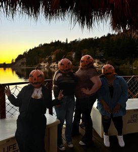 Guests wearing pumpkin costumes at the Hula-ween Luau in Big Bear Lake