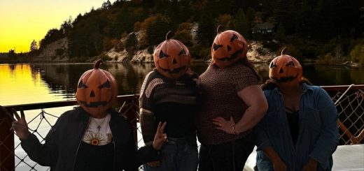 Guests wearing pumpkin costumes at the Hula-ween Luau in Big Bear Lake