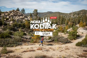 Kodiak Ultra Marathon race log with image behind of runner in remote Big Bear trail