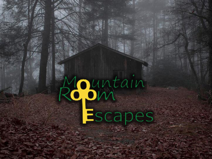A dark, foggy forest with a rustic cabin is the setting for the "Mountain Room Escapes" attraction in Big Bear.
