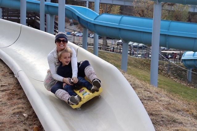 Parent and child enjoying the Alpine Slide at Magic Mountain in Big Bear Lake.