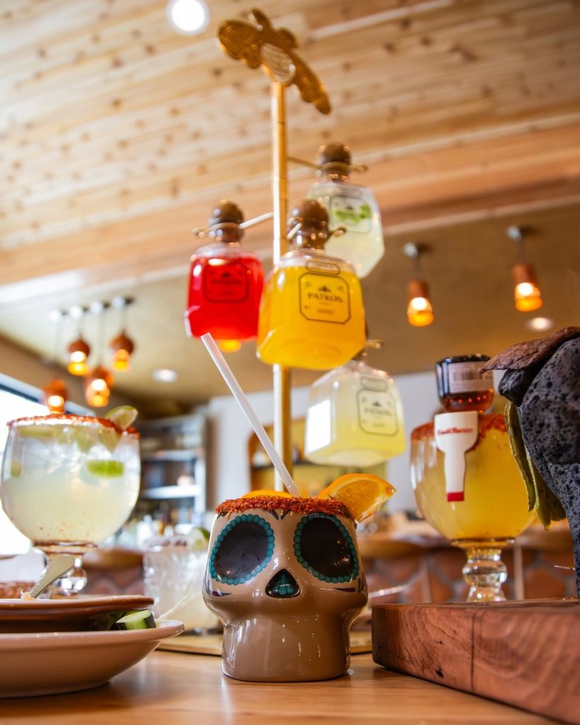 Colorful cocktails and festive drinks displayed at a Big Bear Lake restaurant with a cozy mountain atmosphere