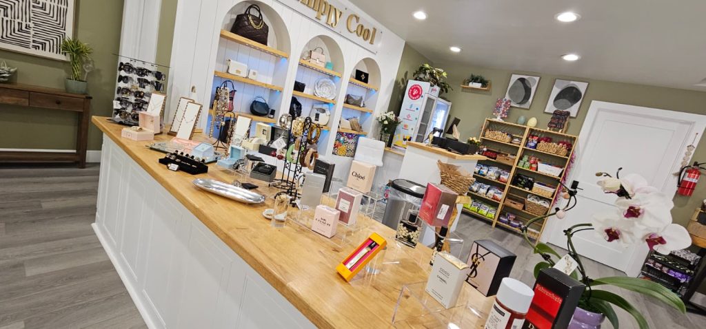Inside view of The Cool Stop Shop with shelves displaying jewelry, accessories, gifts, and specialty products.