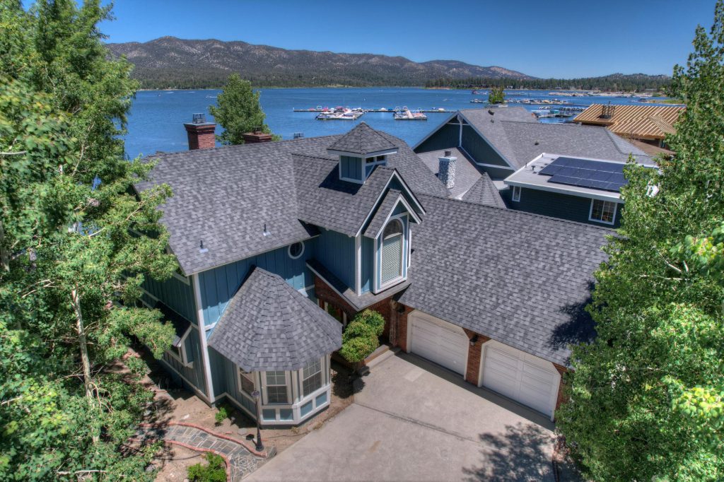Mountain home overlooking Big Bear Lake with marina and mountains