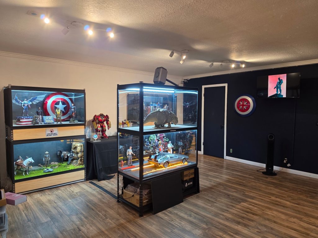 Toytography exhibit space showcasing detailed collectible figures, models, and creative displays