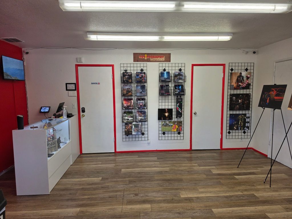 Toytography experience gallery featuring displayed collectible artwork and photography exhibits