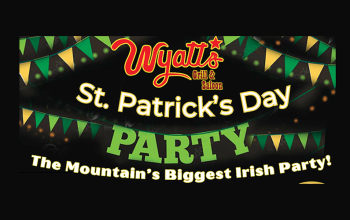 A promotional flyer in green, yellow, and white for Wyatt's Grill & Saloon St Patrick's Day Party The Mountain's Biggest Irish Party! with flags strung up behind the words in yello and green