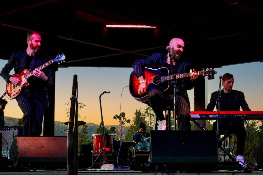 A composite image of a smiling woman, a man in a cowboy hat, and a man playing a guitar.