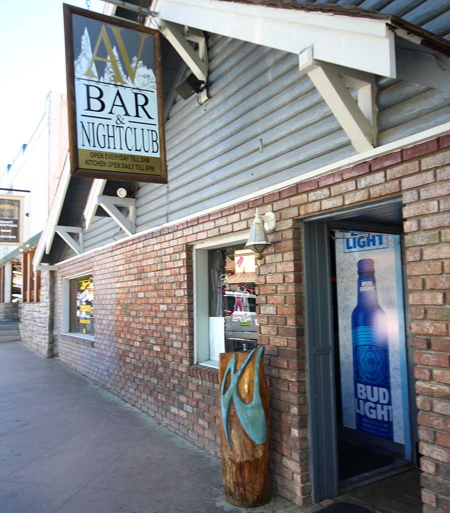 Exterior entrance of AV Bar & Nightclub in Big Bear Lake featuring the venue sign and brick storefront