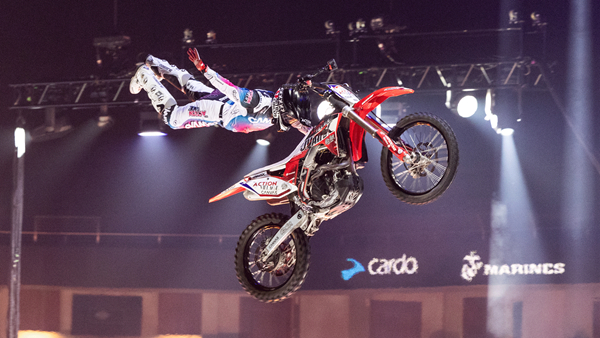 Freestyle motocross rider performing a stunt during a Nitro Circus show in Big Bear.