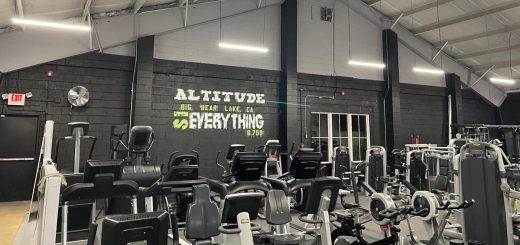 Gym interior with cardio and weight machines at Big Bear Altitude Training Center.