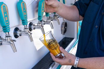 Craft beer being poured from tap at Big Bear Grill and Chill event during Memorial Day weekend