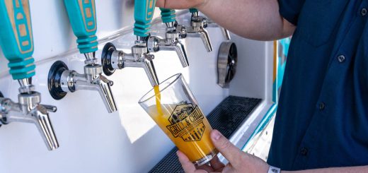 Craft beer being poured from tap at Big Bear Grill and Chill event during Memorial Day weekend