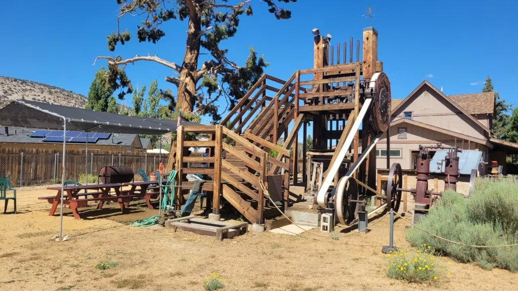 Historic mining equipment exhibit displayed outdoors at the Big Bear Valley Historical Museum.