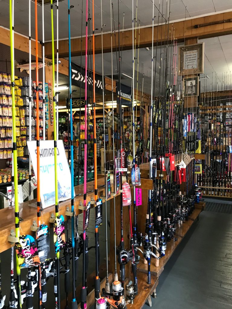 Interior view of Big Bear Sporting Goods showing organized fishing rods, reels, and tackle equipment display